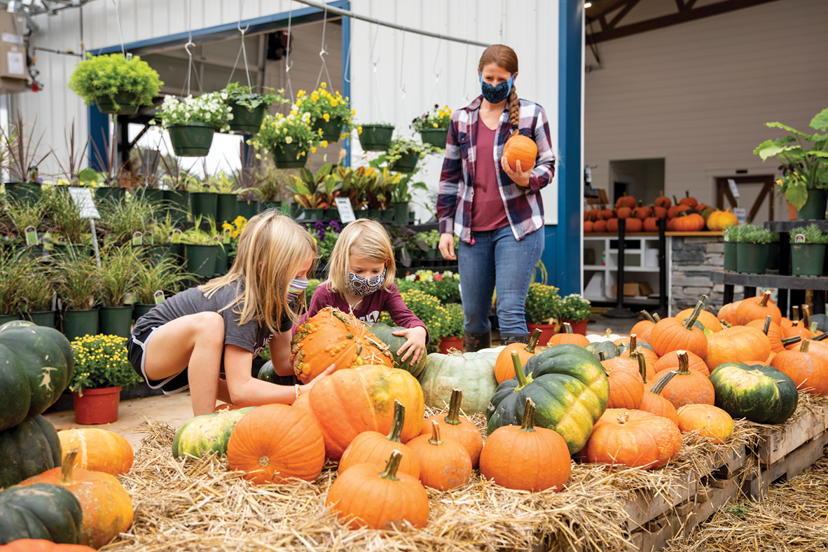 Amy Thomas, from Hillsborough, North Carolina, shops for pumpkins with her two kids, Penny Ruth and Edie Jane.