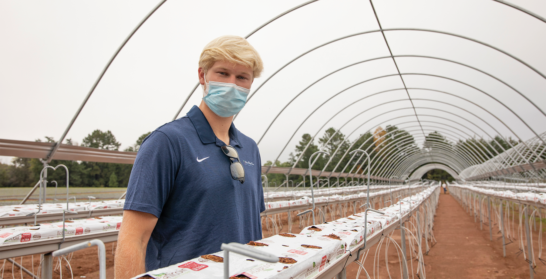 Image of Keegan Czesak in greenhouse